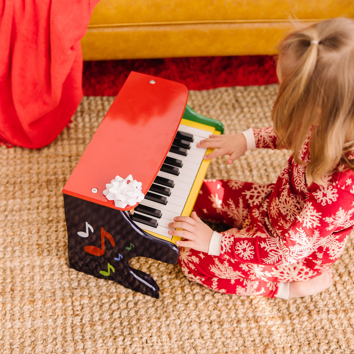 Melissa & Doug Learn-to-Play Piano includes nine melodies for guided play.