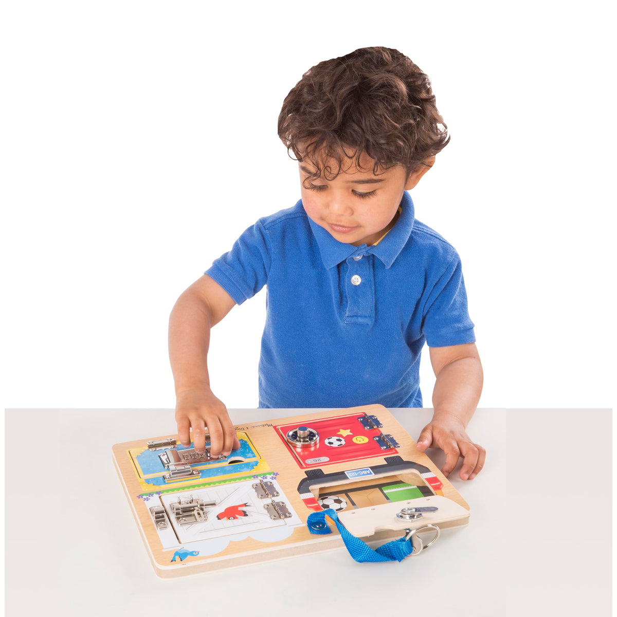 Artwork behind doors on the Melissa and Doug Locks and Latches Board sparks curiosity.