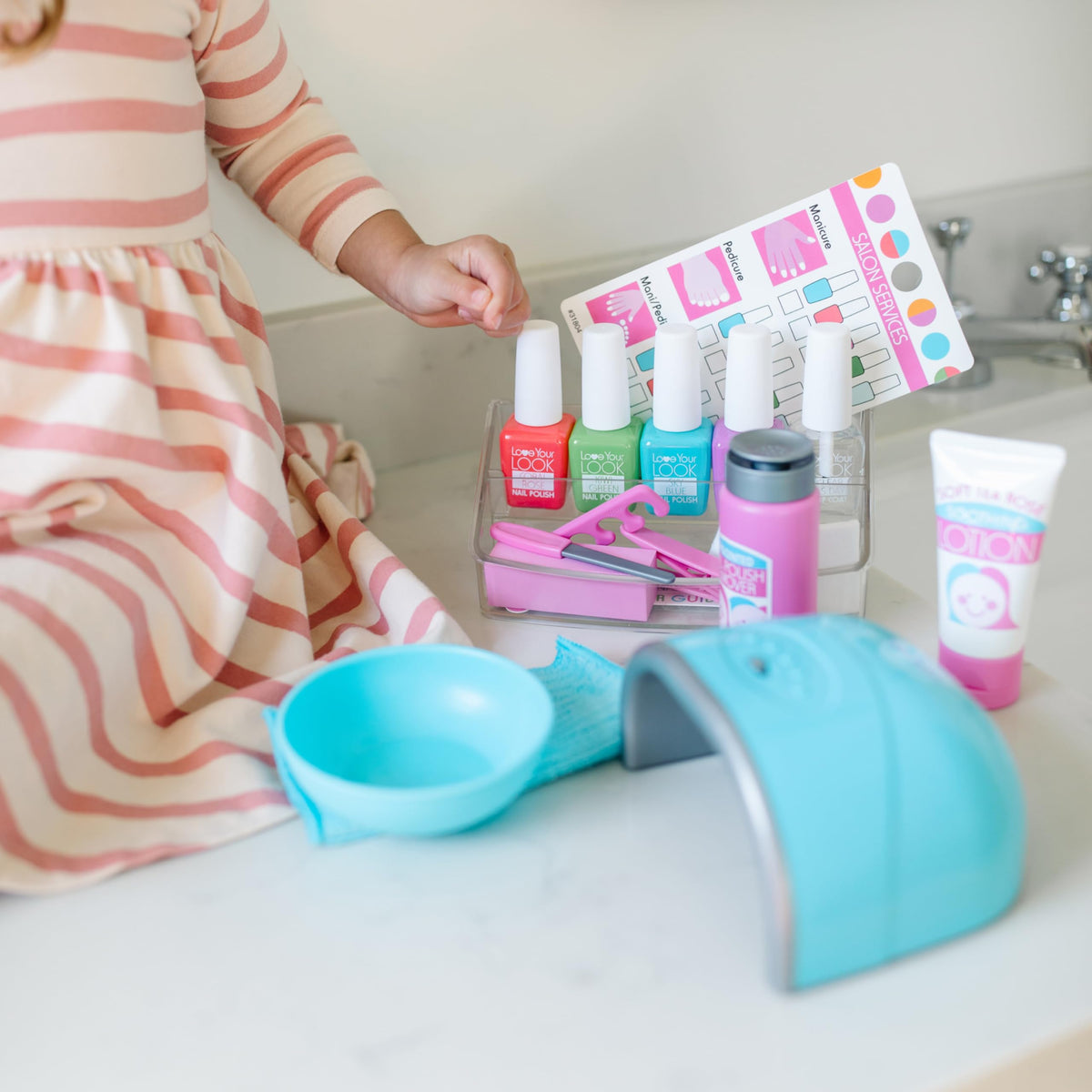 Melissa and Doug Love Your Look pretend nail dryer with LED light for realistic finishing.
