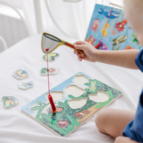Melissa & Doug magnetic fishing wand demonstrates effortless lifting of pieces during pretend fishing