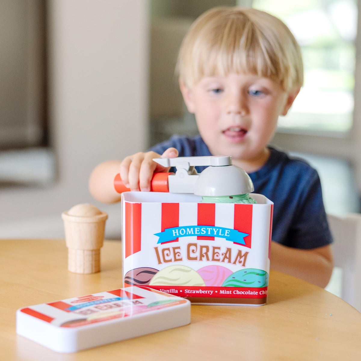 Melissa & Doug magnetic scooper lifts flavors during pretend dessert service.
