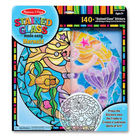 Melissa & Doug mermaid stained glass in sunny window catching light