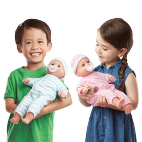 Luke and Lucy twin dolls can suck thumbs or use pacifiers for nurturing play.
