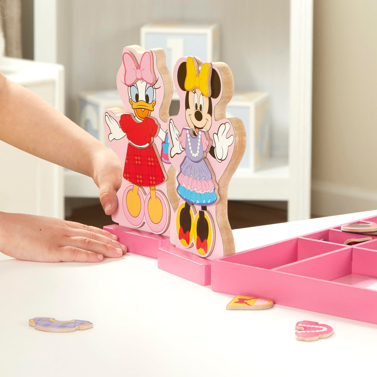 Melissa & Doug Minnie Mouse and Daisy Duck wooden dolls on stands for imaginative dress-up play