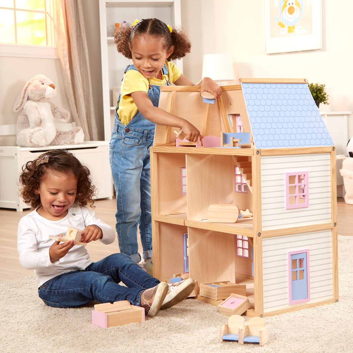 Movable staircases let kids rearrange scenes in the Melissa & Doug dollhouse.