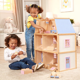 Movable staircases let kids rearrange scenes in the Melissa & Doug dollhouse.