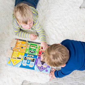 Melissa & Doug numbered doors introduce counting through interactive discovery.