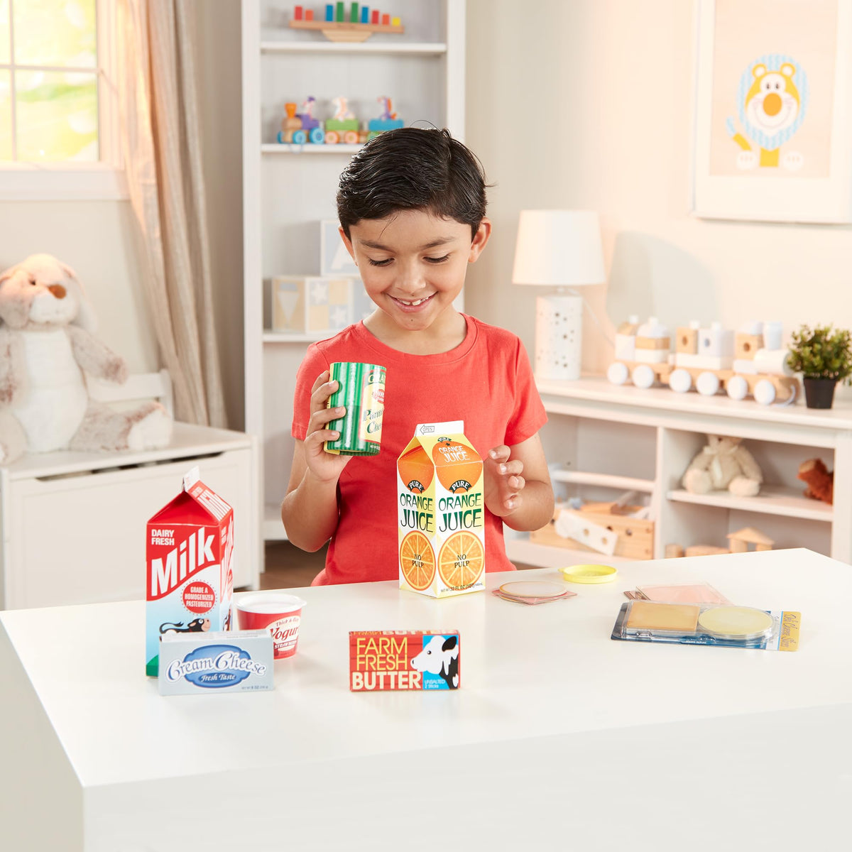 Melissa & Doug orange juice carton for realistic pretend breakfast play.