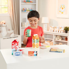 Melissa & Doug orange juice carton for realistic pretend breakfast play.