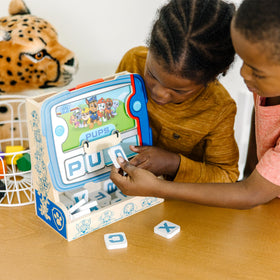 Young spinner visually arranging letters for spelling practice