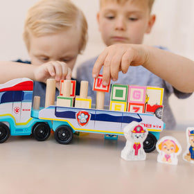 Close-up of PAW Patrol blocks showing letters and numerals for early recognition.