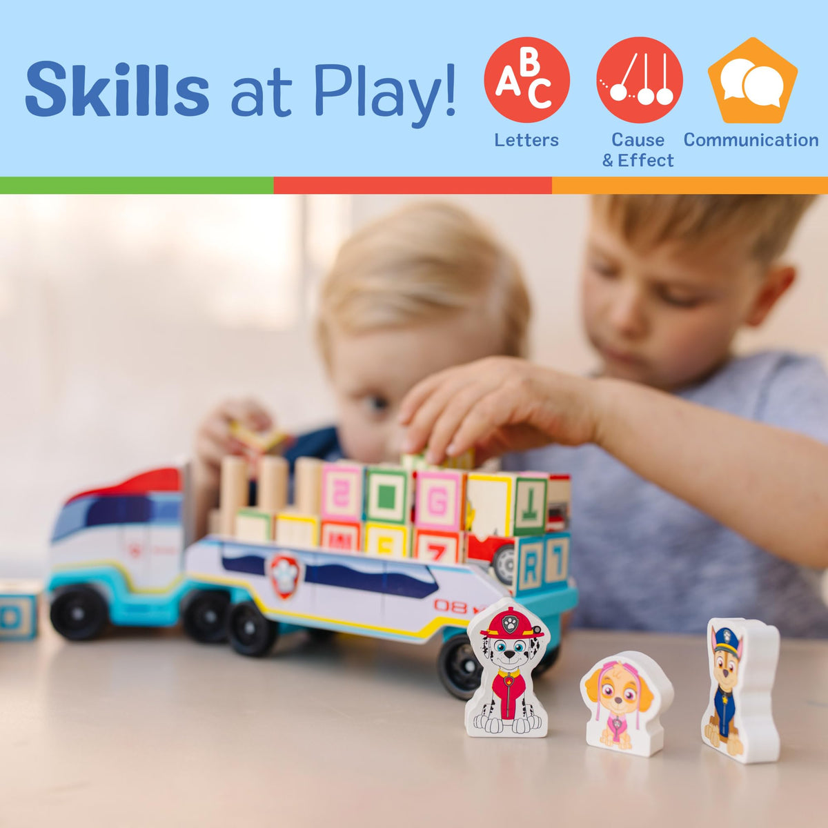 Three wooden figures accompanying the PAW Patrol block truck for imaginative play.