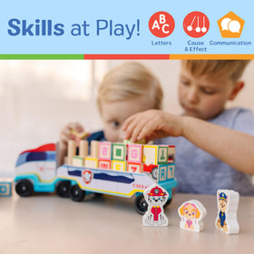 Three wooden figures accompanying the PAW Patrol block truck for imaginative play.