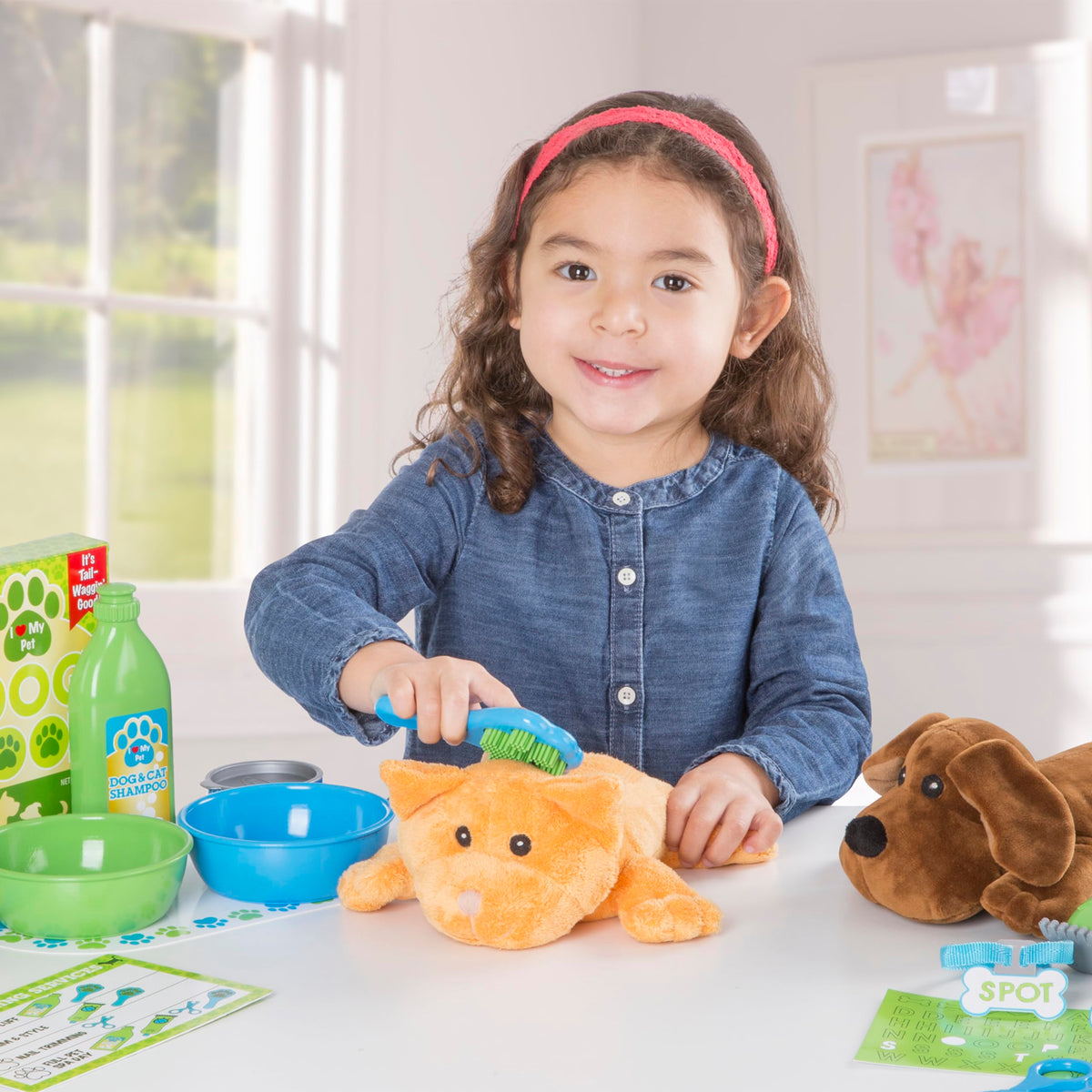 Melissa & Doug grooming brush helps kids practice brushing the plush pets