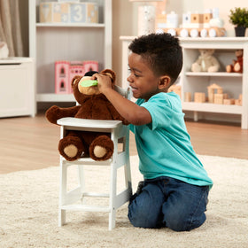 Melissa & Doug high chair fits 20-inch dolls for realistic play scenarios.