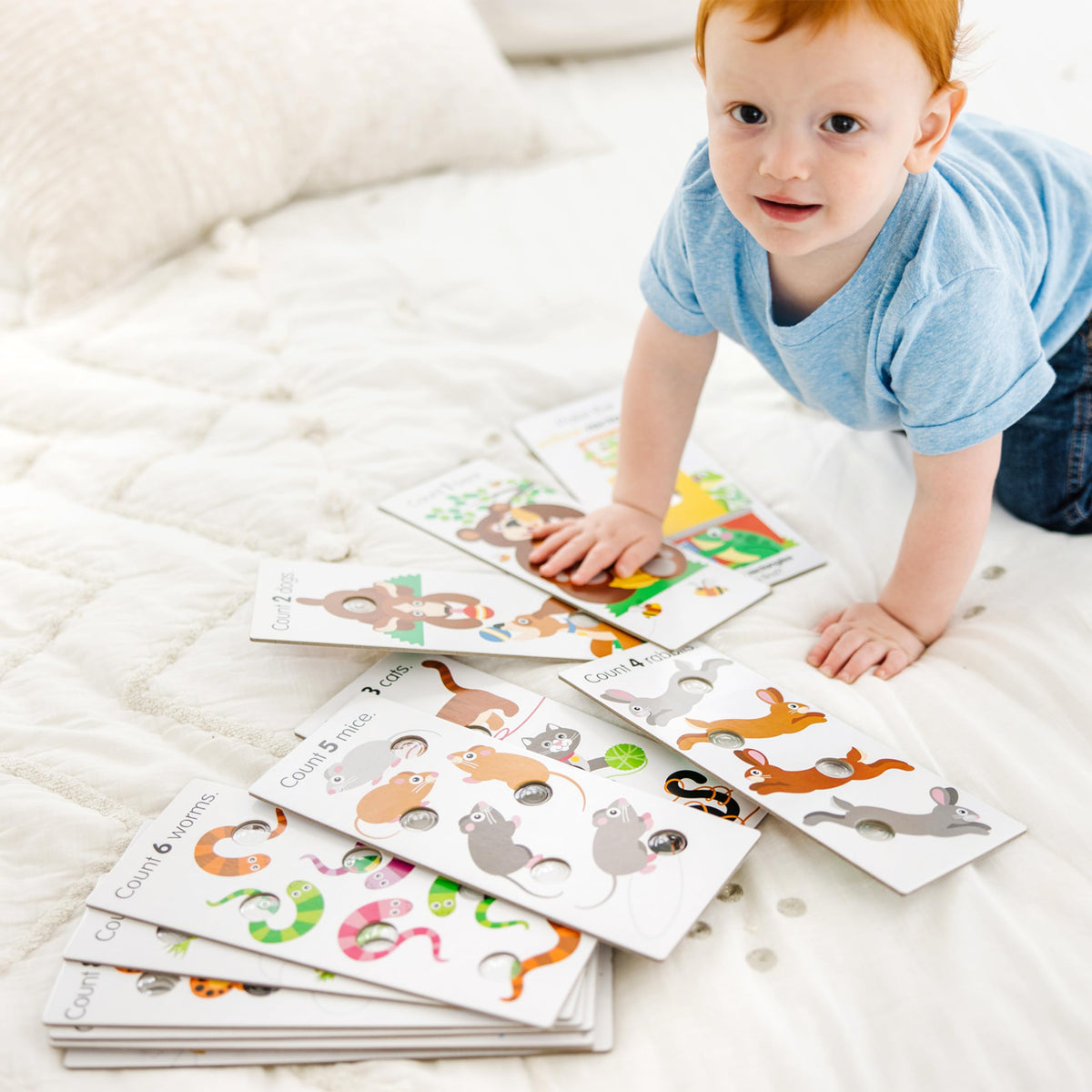 Melissa & Doug Poke-a-Dot double-sided design supports versatile play.
