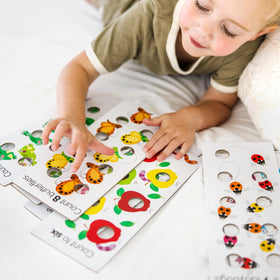 Melissa & Doug Poke-a-Dot textures emphasize raised versus flat surfaces.