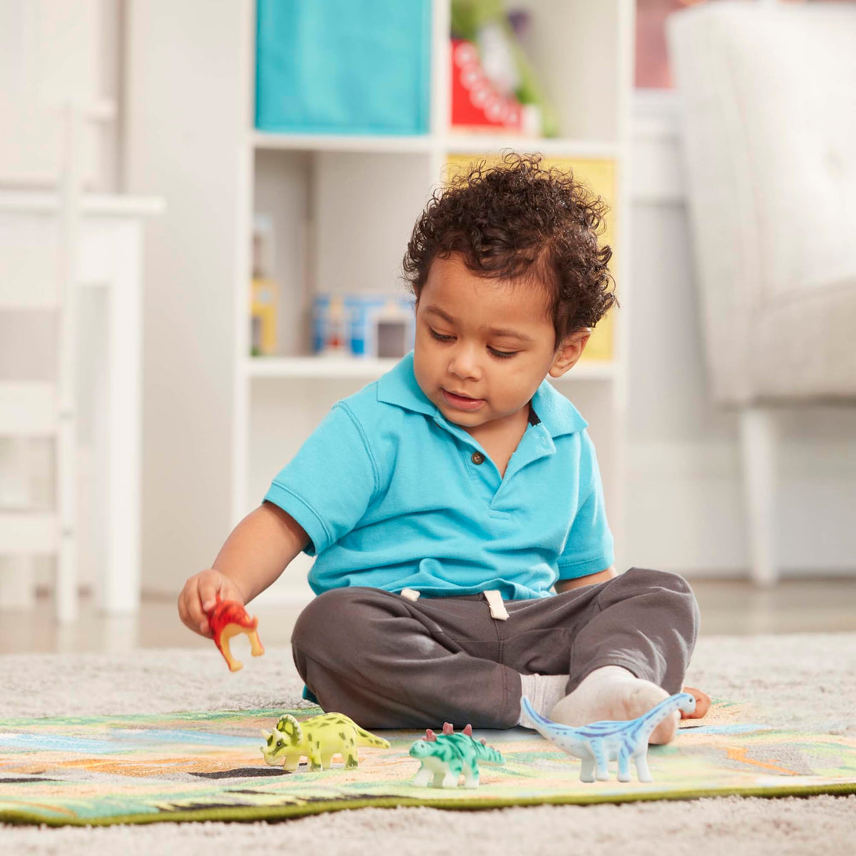 Melissa and Doug dinosaur rug features waterfall detail to spark storytelling.