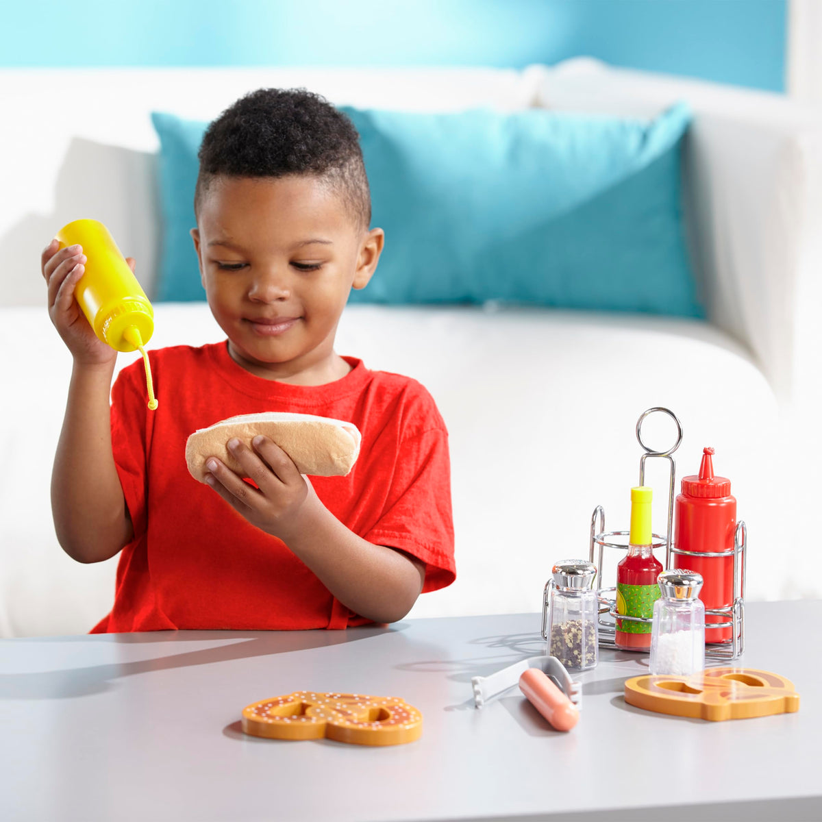 Children explore a pretend kitchen with durable play condiments