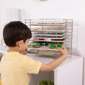 Open design allows kids to easily select and return puzzles