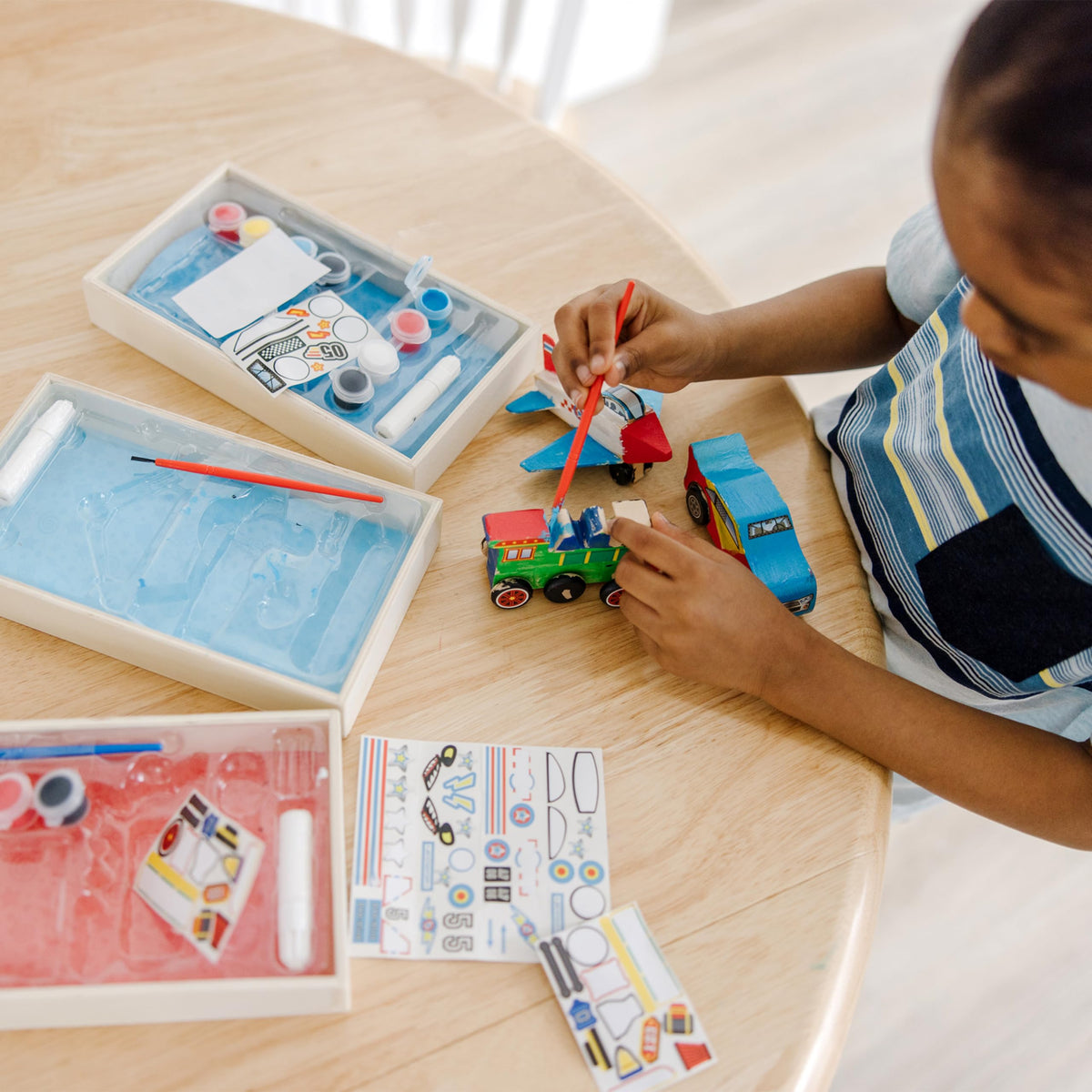 Melissa & Doug race car kit encourages colorful customization and speedy pretend play.