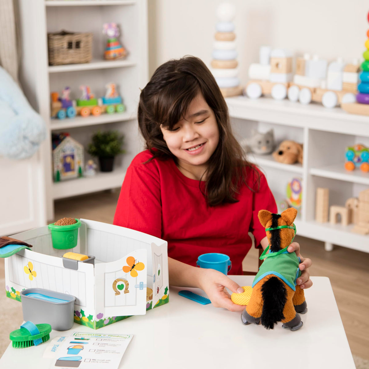 Melissa & Doug saddle, bridle, and blanket provide authentic grooming scenarios.