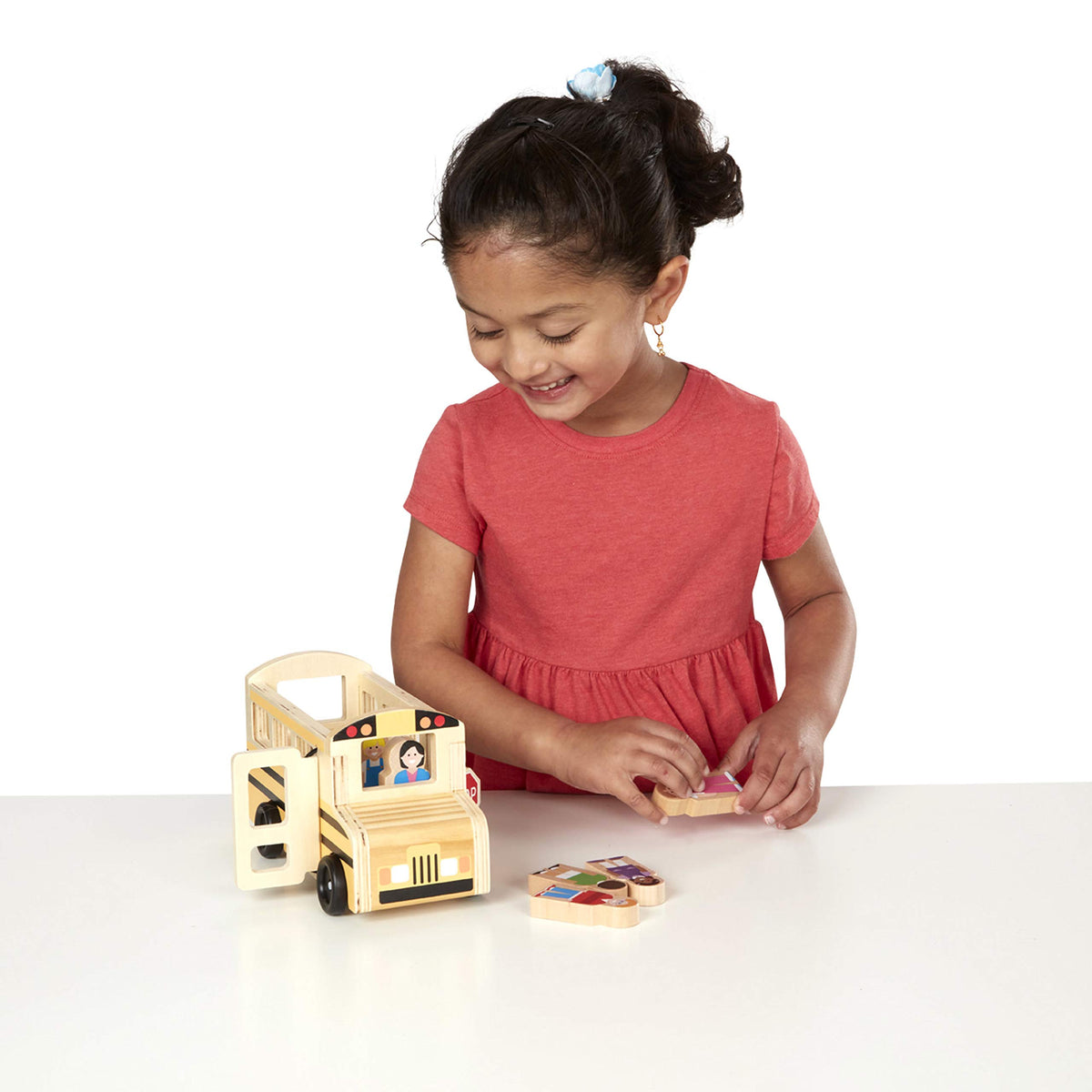 Flip-open stop sign feature in Melissa and Doug bus enhances safe crossing play