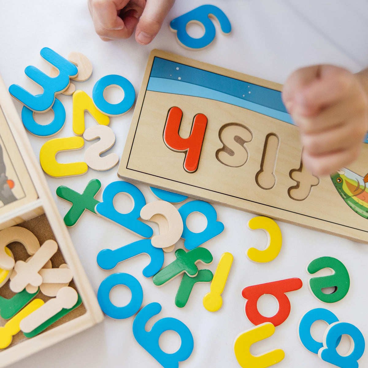 Melissa & Doug See & Spell child-friendly wooden letters spark imaginative word play.