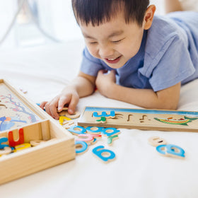 Melissa & Doug See & Spell 64 letters encourage letter familiarity and tactile spelling practice.