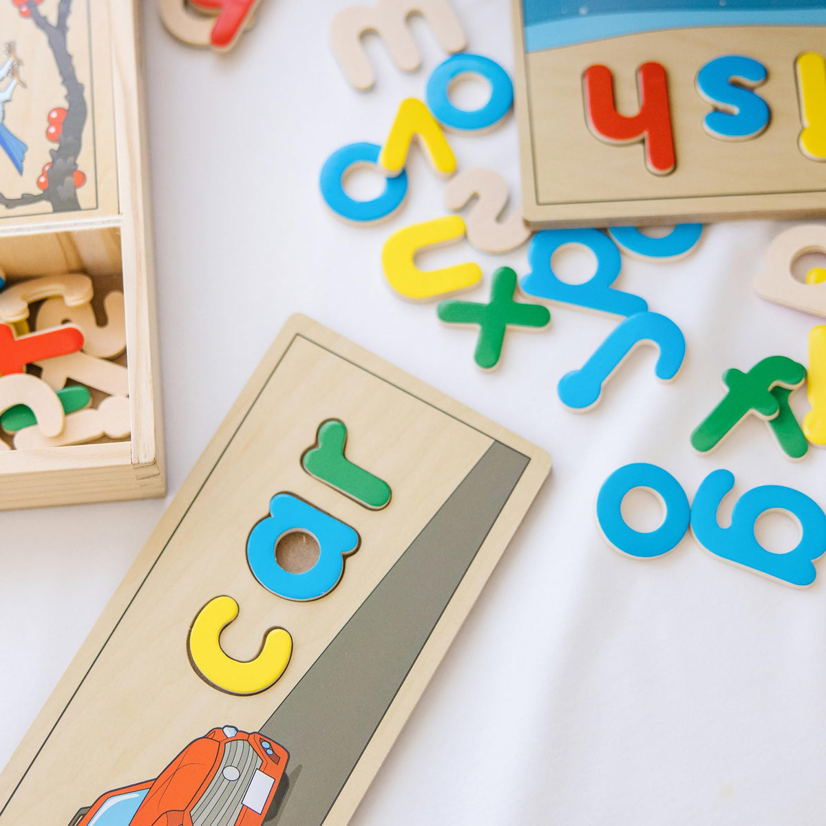 Melissa & Doug See & Spell boards show illustrations to match spelled words.