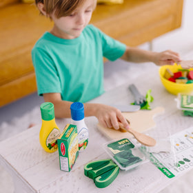 Melissa & Doug Slice & Toss Salad dressing bottles with playful string