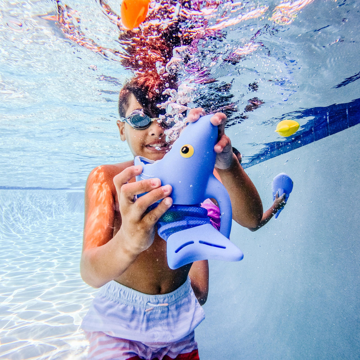Bright Spark Shark colors boost engaging, screen-free pool fun.