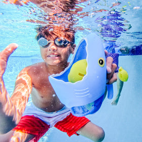 Spark Shark fish sinkers float, ready for quick pool scoops.