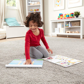 Glossy background pages from Melissa & Doug sticker pad enhance vivid scene creation