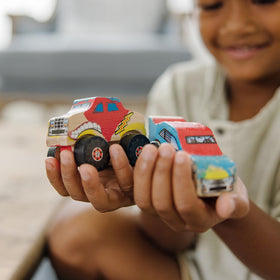 Colorful stickers add flair to Melissa & Doug race car and monster truck.