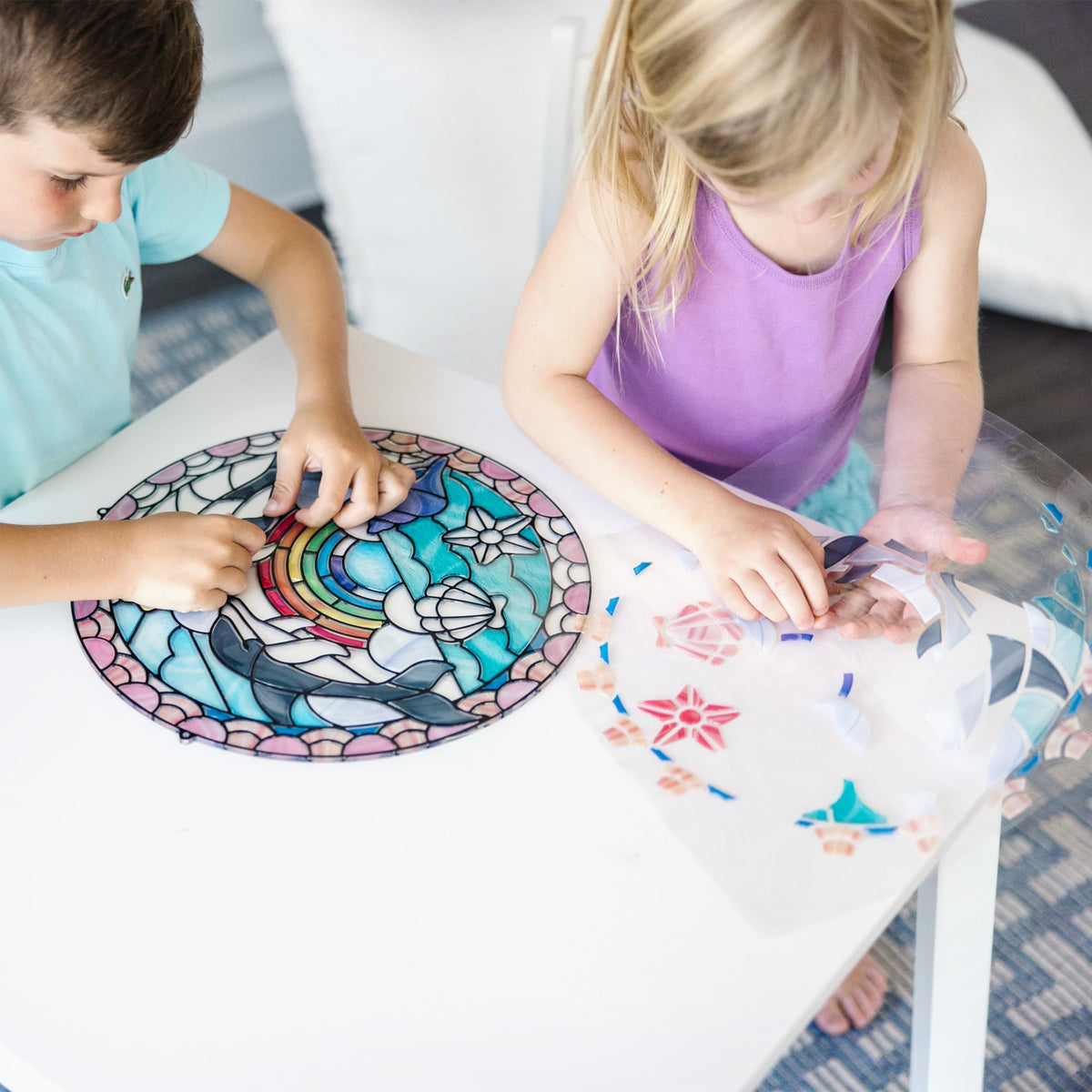 Melissa & Doug sunlit stained-glass dolphins shimmer in bright light