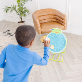 Kids tossing bean bags indoors with Melissa & Doug Sunny Patch Dilly Dally Turtle Target Action Game