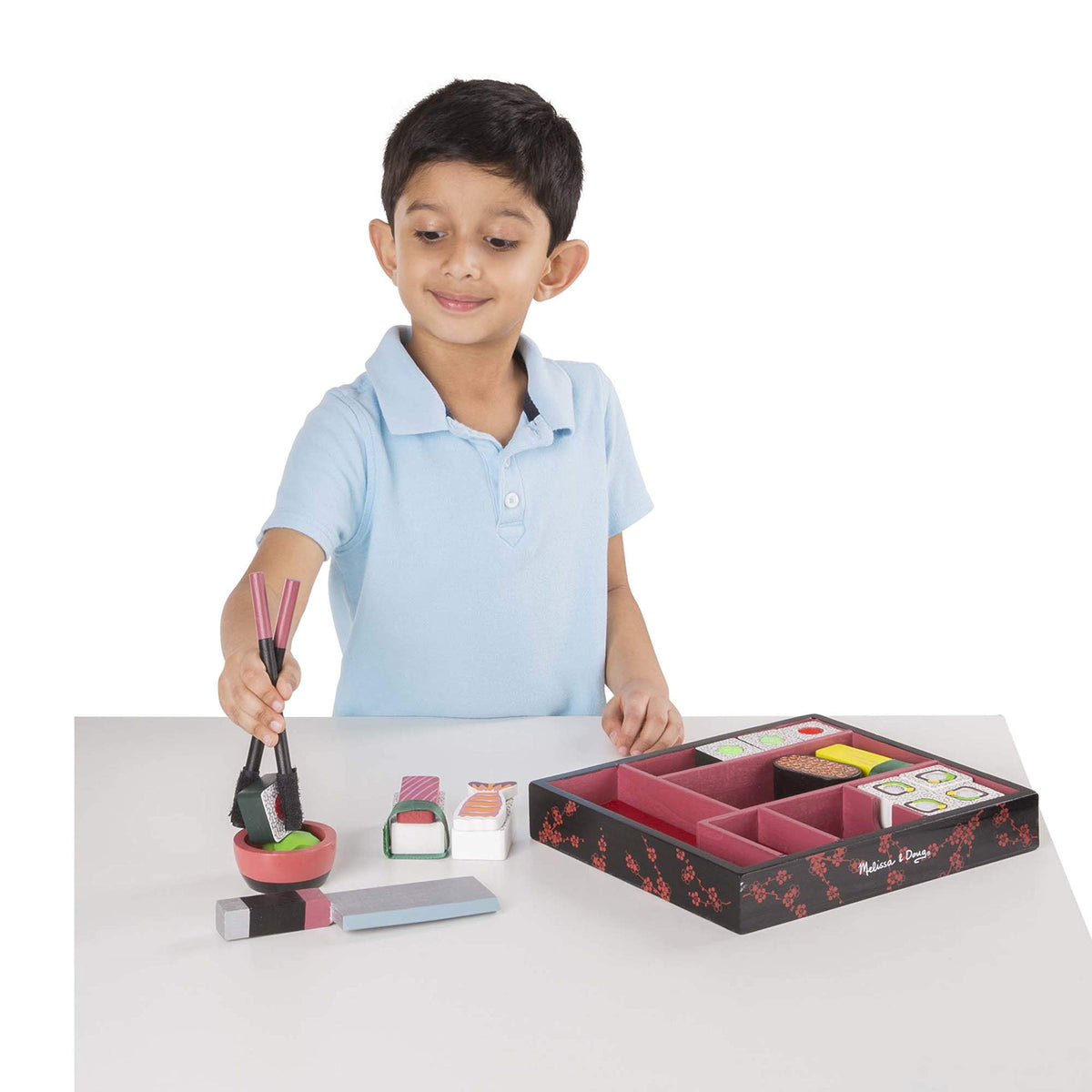 Melissa & Doug dipping bowl and chopsticks support hands-on play.