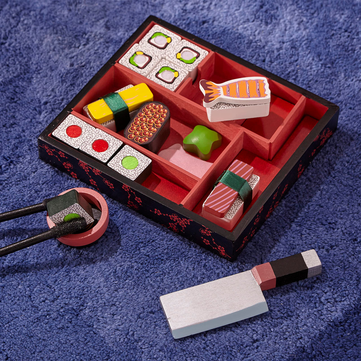 Melissa & Doug pretend sushi kit promotes imaginative kitchen play.