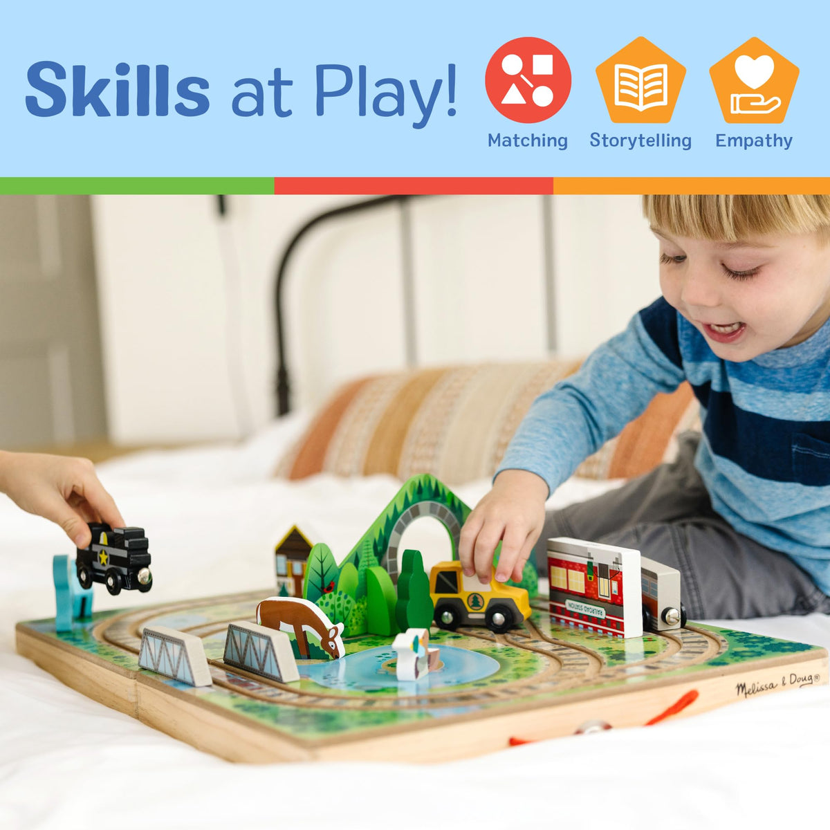 Melissa & Doug Take-Along Railroad includes three toddler trains and ranger truck.