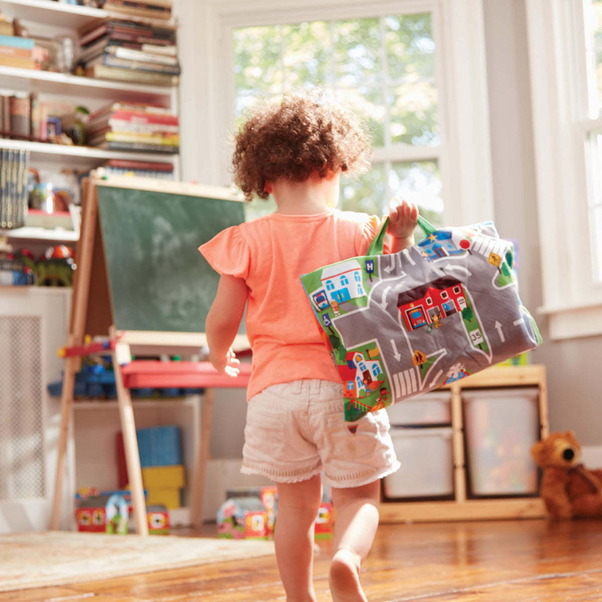 Melissa & Doug Take-Along Town Play Mat close-up crinkle vehicle for sensory play.