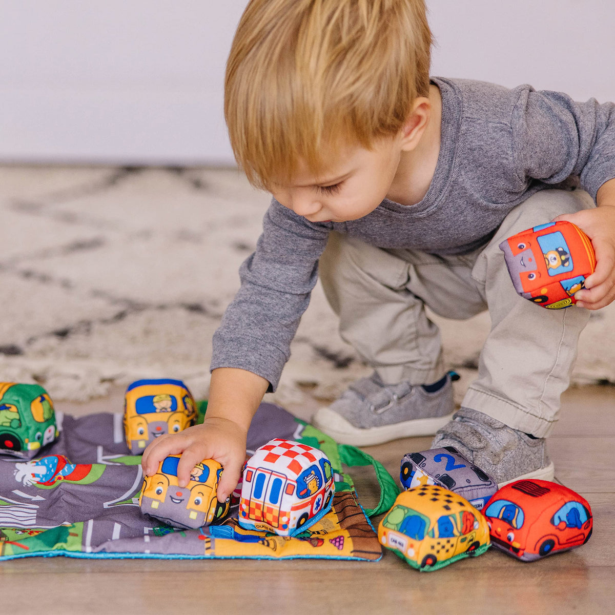 Melissa & Doug Take-Along Town Play Mat folded storage bag for travel.