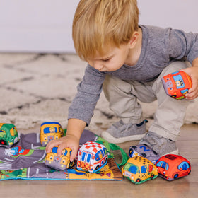 Melissa & Doug Take-Along Town Play Mat folded storage bag for travel.