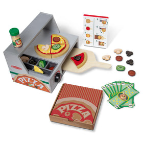 Melissa & Doug Top & Bake wooden pizza counter setup with ingredients for creative pretend cooking.