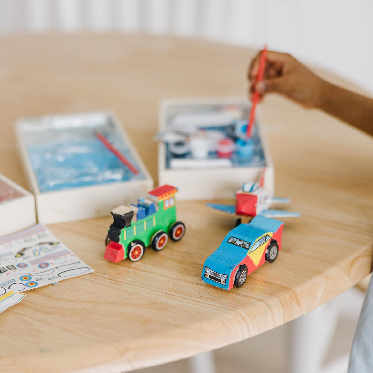Melissa & Doug train kit with wheels invites hands-on play and learning.