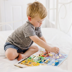 Melissa & Doug travel-friendly busy board with durable, self-contained design.