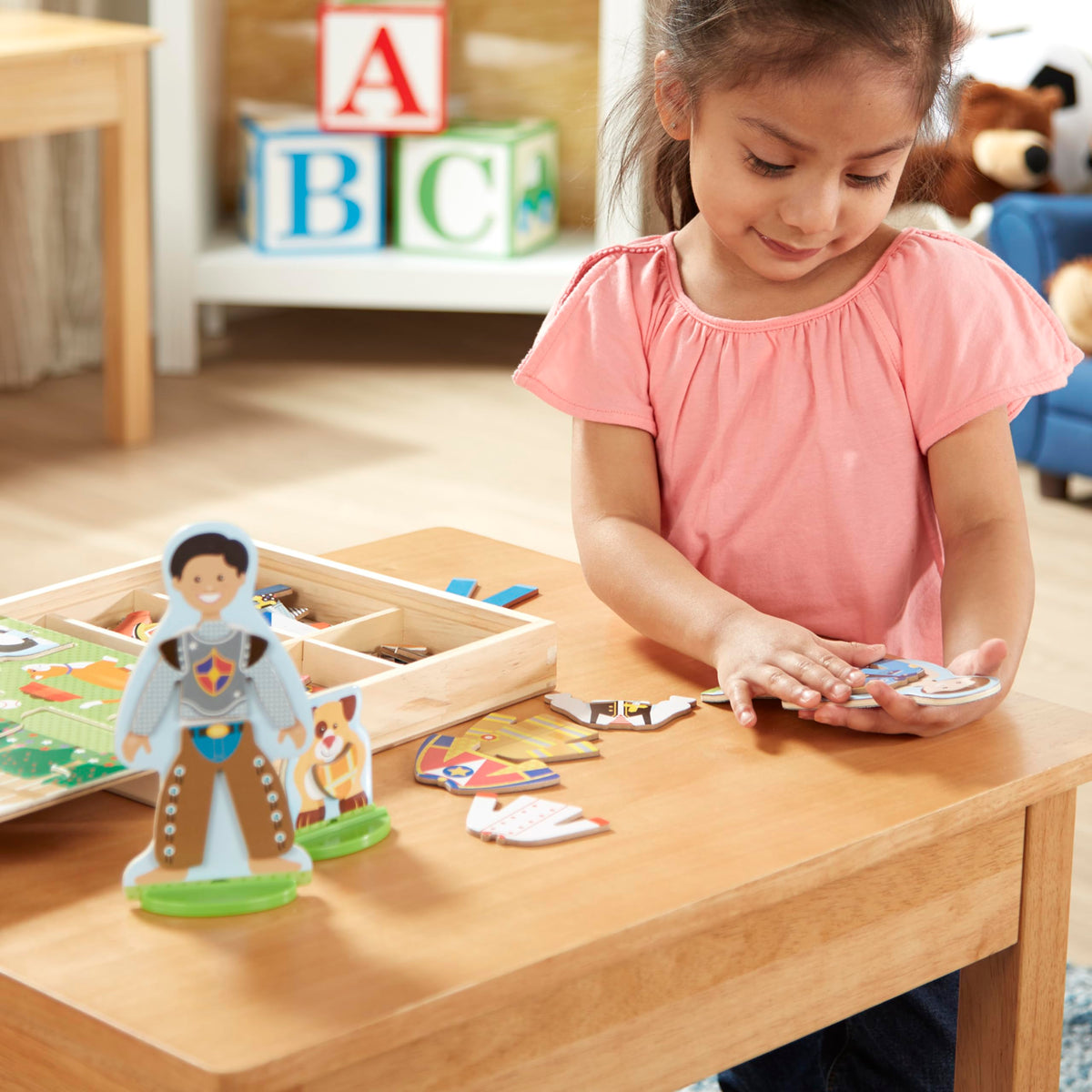 Travel-friendly case supports on-the-go Melissa & Doug dress-up creativity.