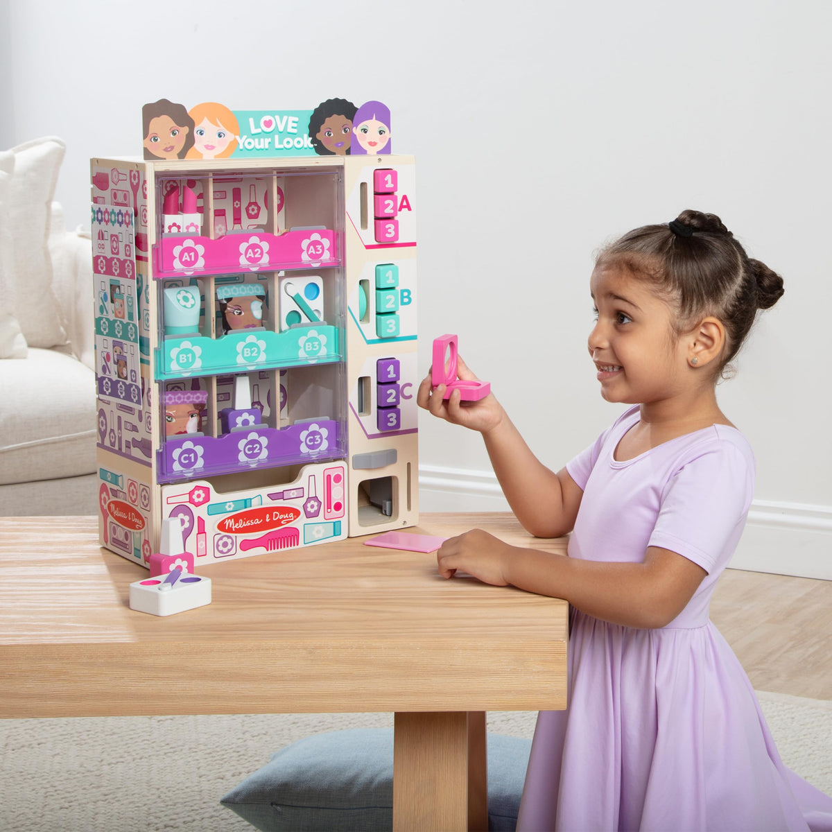 Melissa & Doug beauty kiosk stocked with wooden items for color-matching sorting activity