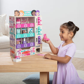Melissa & Doug beauty kiosk stocked with wooden items for color-matching sorting activity