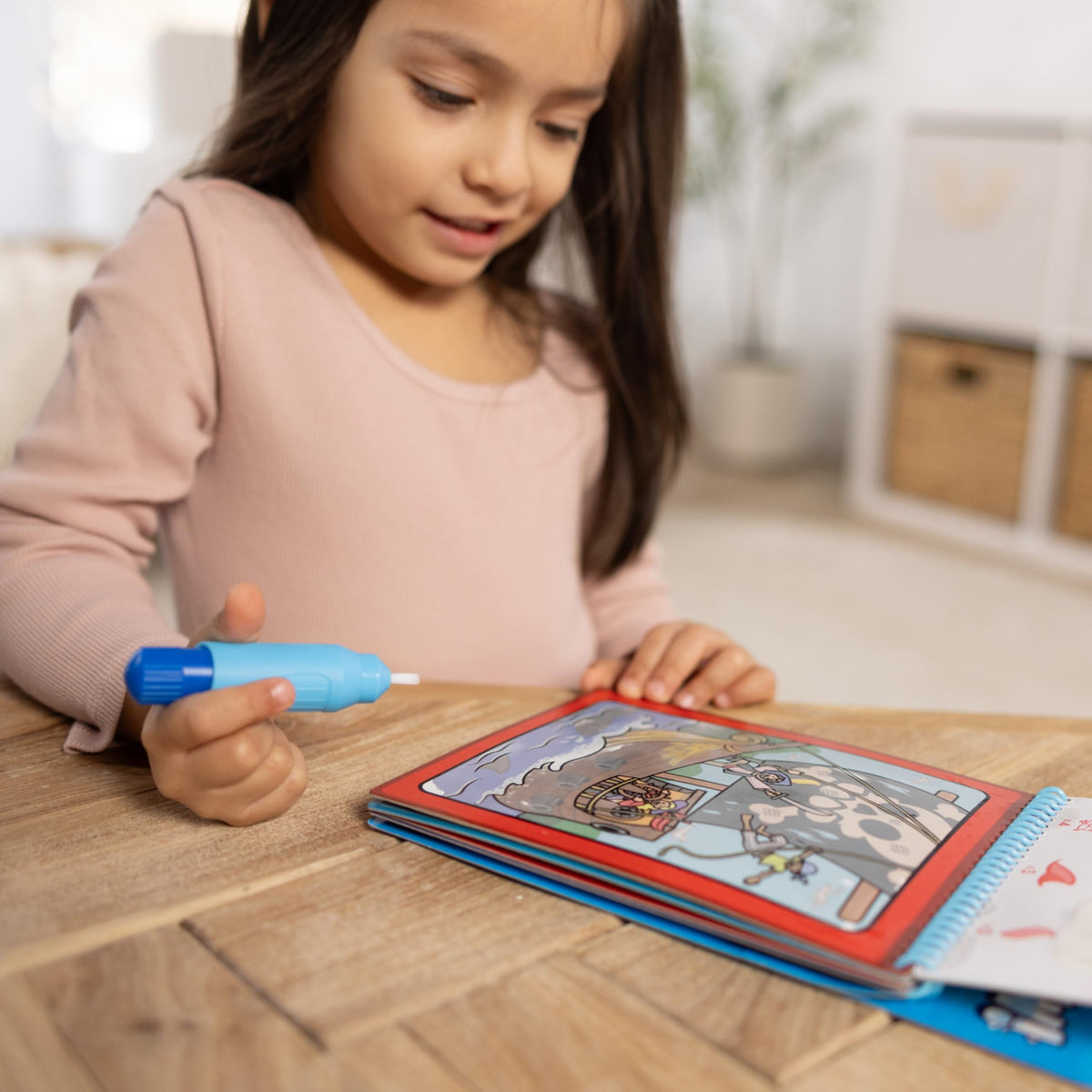 Melissa & Doug Water Wow dinosaur color reveal page supports fine motor skills.